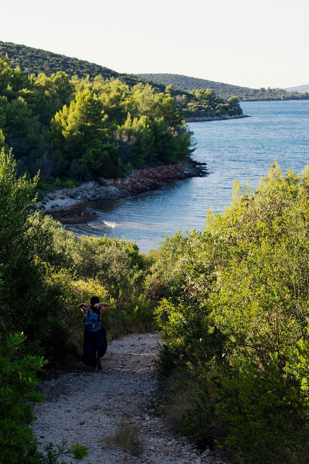 Elderly Croatian woman and man on a nature walking tour with walking poles